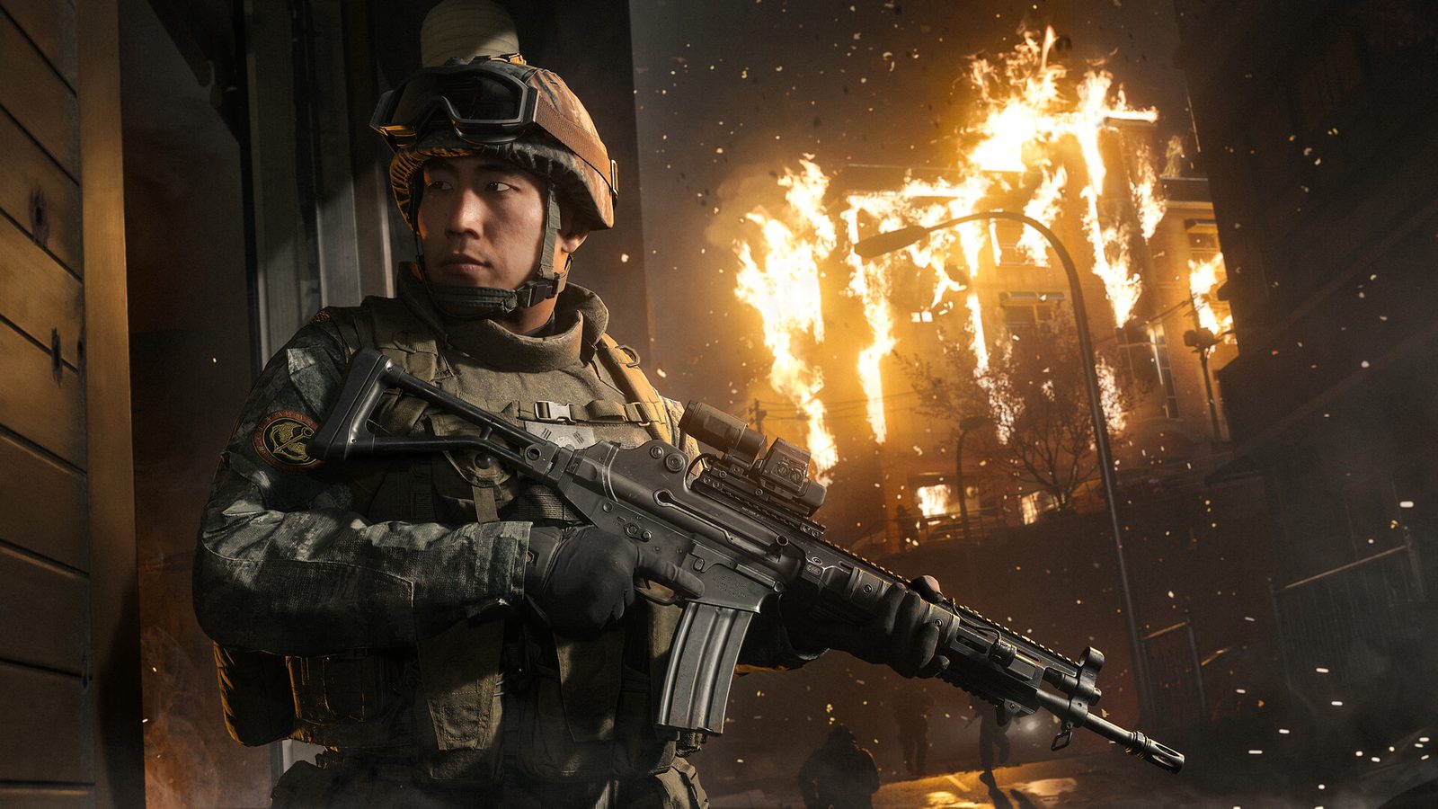 Un soldat devant un bâtiment en flammes dans Modern Warfare 4